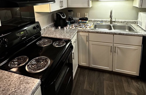 West Bloomington Condo | luxurious retreat w top-notch features, AC, play area, game fun, gym & patio
