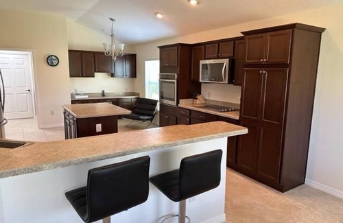 Fernandina House | Luxury 2 bed/2 bath designer home near Brownwood 2 person gas cart