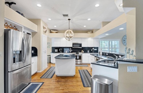 Palm Island House | Luxury 4 Bedroom pool home close to beach, private dock on Kettle Harbor.
