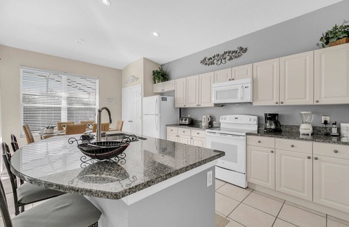 Windsor Palms Villa | Luxury 4BR/3BA Windsor Palms Villa, Woodland Views, Sun-Filled Pool Deck