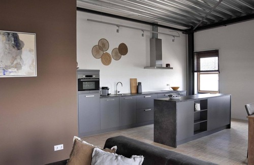 Stellendam House | Luxury apartment on the first floor with a private terrace and waterfront view.