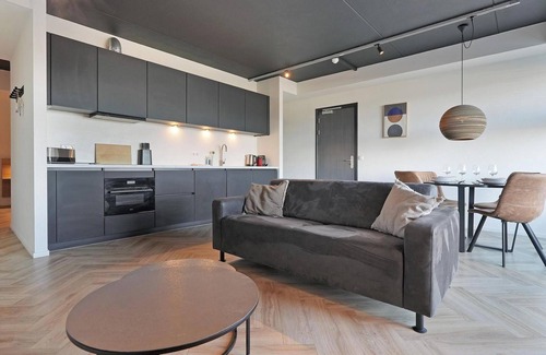 Stellendam House | Luxury apartment with private terrace, spacious living room, and stunning view of the Inner Harbor.