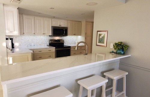 Isla del Sol Condo | LUXURY BAHIA POINTE WATERFRONT Condo/Panoramic Views! Dolphins, Manatee, More!