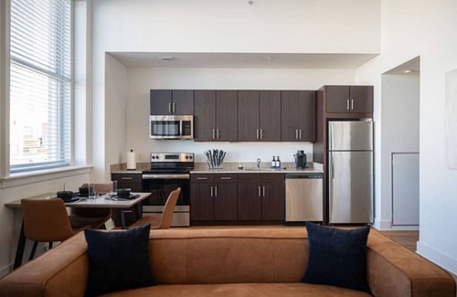 Central City Apartment | Luxury suite w/gym, pool, eateries, & theater