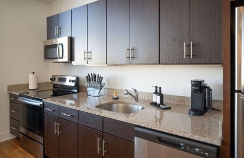 Central City Apartment | Luxury suite w/gym, pool, eateries, & theater