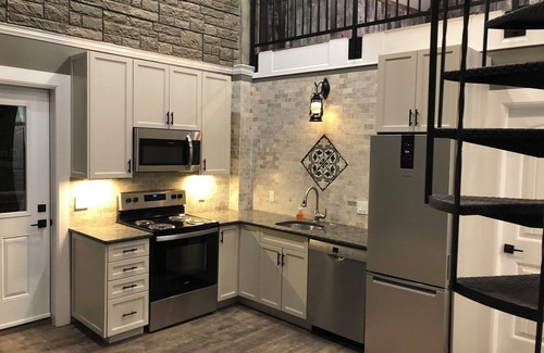 Inner Harbour Apartment | Luxury, top floor suite with free parking space. Walking distance to downtown!