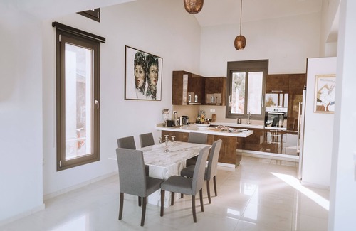 Elounda Villa | luxury villa in front of a historic famous island
