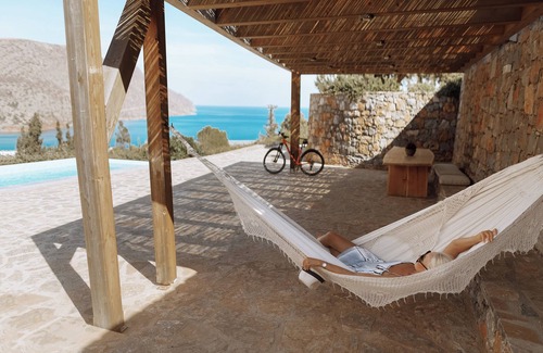 Elounda Villa | luxury villa in front of a historic famous island