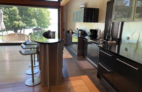 Suttons Bay House | Luxury waterfront home on W. Grand Traverse Bay. Soaking tub. Kayaks.