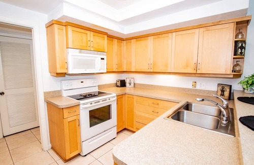Fairway Village House | Magnolias on Cobblestone – Stylish Pet Friendly Retreat w/Private Lanai, Pool Access & Smart TVs!