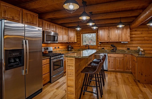Meeteetse Cabin | Majestic Wyoming Landscape. Riverfront log cabin. Relax in or explore out!