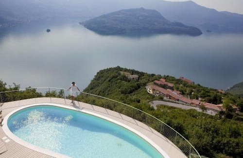 Plassi Apartment | Mantegna - garden with Lake view and swimming pool