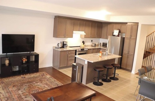 Markham House | Markham home near Toronto with dual patios, bright