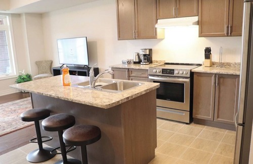 Markham House | Markham home near Toronto with dual patios, bright