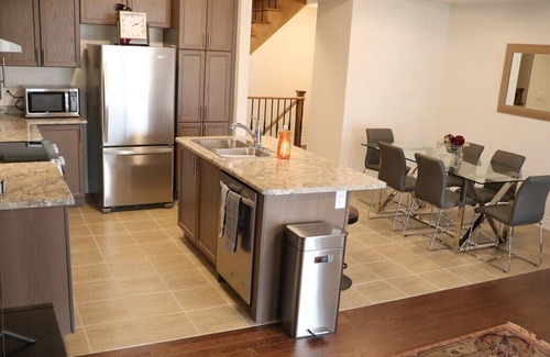 Markham House | Markham home near Toronto with dual patios, bright