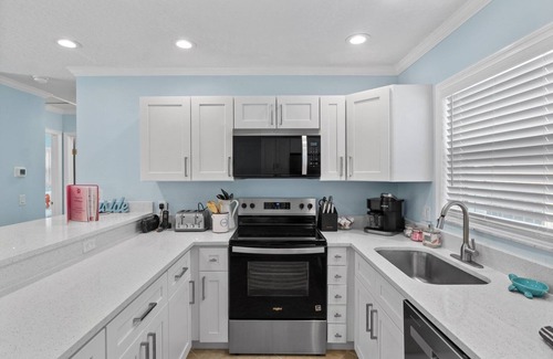 Anna Maria House | McBean Point: Dog Friendly! Walk to Bean Point! by Anna Maria Life Vacation Rentals