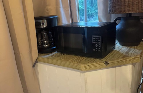 Mentone RV Rental | Mentone glamping getaway in a private screened in cabin in charming Mentone