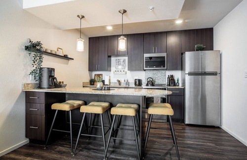Overland Park Apartment | Mid-Rise Luxury 1 BR 1 BD Free Carport Parking WiFi and Dedicated Workspace