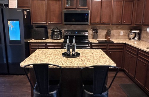 Midland House | Midland Manor, your home away from home! PS5, 86in tv, pool table, BBQ & more!