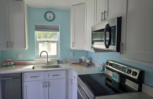 Treasure Island Villa | Million Dollar Views! Waterfront 2 bedroom/2 bath duplex with pool and dock.