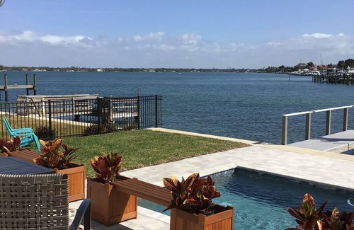 Treasure Island Villa | Million Dollar Views! Waterfront 2 bedroom/2 bath duplex with pool and dock.