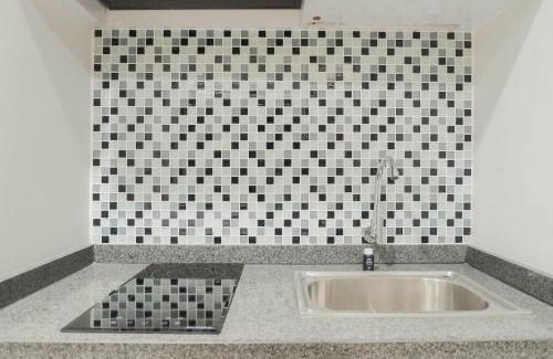 Surabaya Apartment | Minimalist Studio Apartment at Taman Melati By Travelio