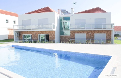 Salir do Porto Apartment | Modern, air-conditioned family apartment with pool. 10 minute walk to beach