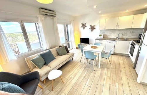 Cala en Porter Apartment | Modern apartment with a fantastic view over the bay