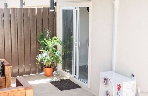 Bubali Apartment | Modern, clean and neat apartment. Walking distance to beach and restaurants.