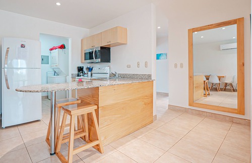 Villarreal Condo | Modern condo near beaches with mountain views, outdoor pool, balcony, W/D, AC