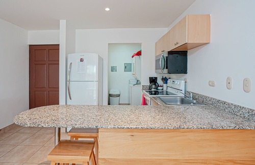 Villarreal Condo | Modern condo near beaches with mountain views, outdoor pool, balcony, W/D, AC