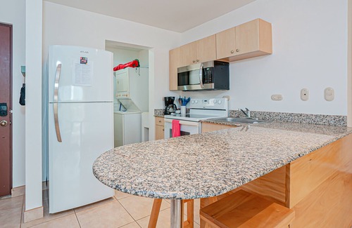 Villarreal Condo | Modern condo near beaches with mountain views, outdoor pool, balcony, W/D, AC