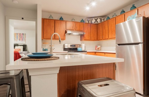 West Campus Apartment | Modern Condo With Pool, Gym, Workspaces & BBQ