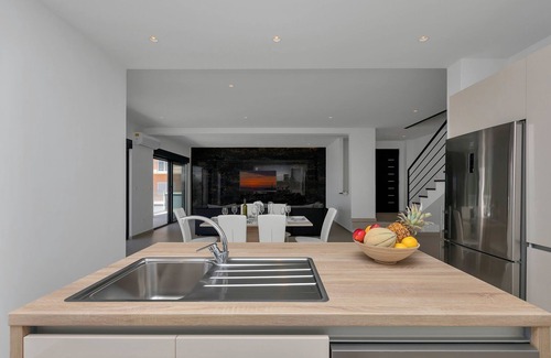 Bast House | Modern holiday home with infinity pool, three bedrooms, terrace, sea view