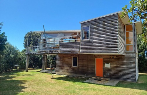 Whiritoa House | Modern Kiwi family bach right on the beach. Private & pet friendly.