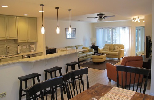 West Beach Cottage | Modern Lagoon View Steps from Beach Pool & Golf