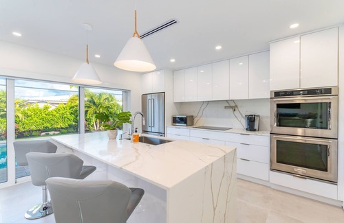 Imperial Point House | Modern Oasis, Heated Pool, Short Drive to Beach