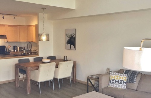 Canmore Condo | Modern, rustic mountain view loft style condo with pool, hot tubs & XL beds.