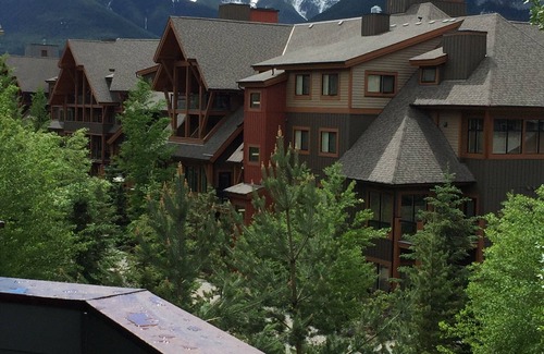 Canmore Condo | Modern, rustic mountain view loft style condo with pool, hot tubs & XL beds.