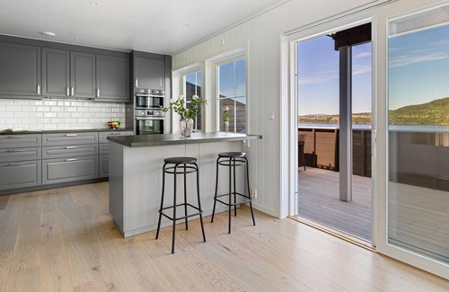 Osteroy House | Modern semi-detached house in natural surroundings with beautiful fjord view.