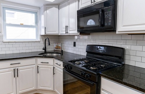 Queens Apartment | Modern vacation rental w/hot tub. 15 minutes from the airport