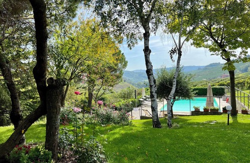 San Bovo Villa | Modern villa with private pool and panoramic vineyard views in Piemonte.