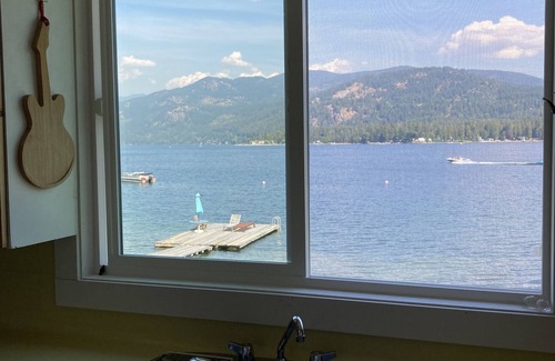 Christina Lake House | Modern Vintage Lake Front Cabin. Huge Private Beach and Dock.