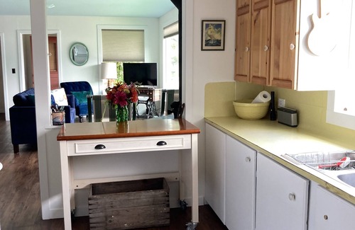 Christina Lake House | Modern Vintage Lake Front Cabin. Huge Private Beach and Dock.
