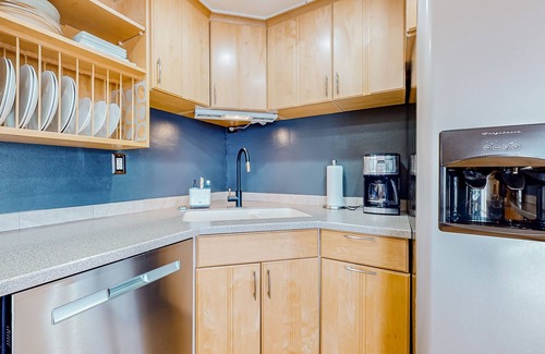 Adelma Beach House | Modern water view retreat with foosball table, expansive deck, and gas fireplace
