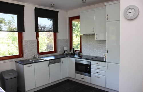 Szolad Villa | Modernly furnished, detached basement villa with spacious garden. Three bedrooms, two bathrooms.