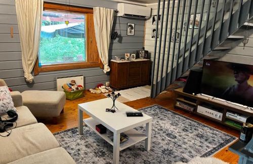 Etelainen House | Mökkituulos, beds for 4 One big bedroom, two beds separated with a big wardrobe