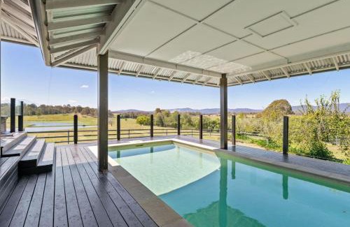 Tamborine House | Mountain Majesty with Poolside Relaxing Getaway
