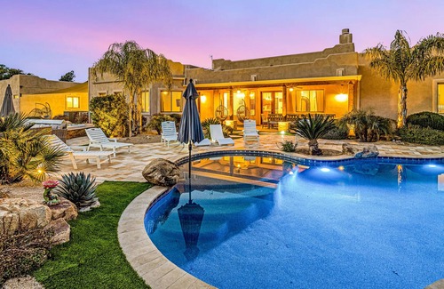 Anthem House | Mountain-view stay with sprawling outdoor space, pool, hot tub, & putting green