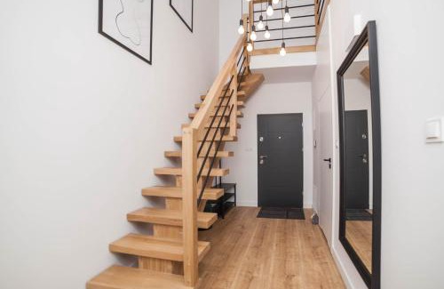 Mragowo Apartment | Mrągowo dwupoziomowy Apartament Indygo 85m2 z widokiem na jezioro